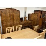 An early 20th century burr walnut bedroom suite comprising two wardrobes,