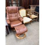 A brown leather swivel chair and matching foot stool together with two assorted elbow chairs