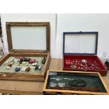 Three table top display cabinets including amber beads, bone handled Stanhope propelling pencil,