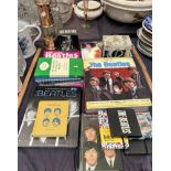 The Bootleg Beatles yearly book together with books on the Beatles, mugs,