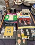 The Bootleg Beatles yearly book together with books on the Beatles, mugs,
