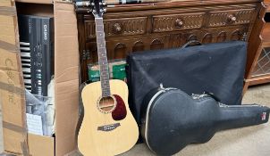 An Artist acoustic guitar together with a guitar case, Casio keyboard,