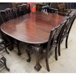 A 19th century mahogany extending dining table with an oval top on leaf carved cabriole legs and