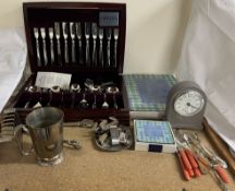 An Oneida cased part flatware service together with place mats,