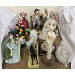 A Beswick model of a mare and foal together with four Royal Doulton figures,