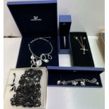 A collection of Swarovski jewellery including bracelets,