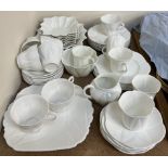 A Shelley porcelain part tea set in white of leaf form