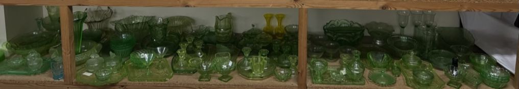 A large collection of Uranium glass including part dressing table sets, drinking glasses, bowls,