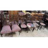 A set of four Edwardian mahogany salon chairs together with a pair of carved oak dining chairs,
