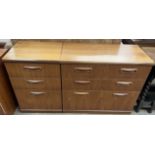 A mid 20th century chest with three long drawers together with a matching smaller teak chest