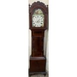 A 19th century mahogany longcase clock with an arched hood with rope twist columns and a short
