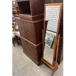 A mid 20th century Cheval mirror together with a television cabinet,