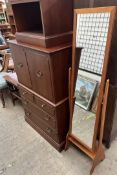 A mid 20th century Cheval mirror together with a television cabinet,