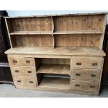 A pine dresser, the rack with two shelves,