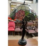 A Tiffany style table lamp, the glass shade with floral and leaf panels,