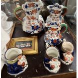 A Set of three graduated pottery Masons jugs together with Allertons jugs