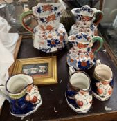 A Set of three graduated pottery Masons jugs together with Allertons jugs