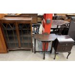 A 20th century walnut display cabinet with a pair of glazed doors on cabriole legs and claw and