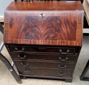 A reproduction mahogany bureau