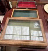 An oak framed table top display cabinet together with two other table top display cabinets