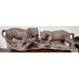 Zimbabwe Game Carvers The Lions Feast A large carving depiction a lion and lioness devouring a