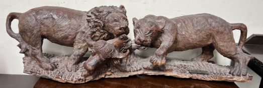 Zimbabwe Game Carvers The Lions Feast A large carving depiction a lion and lioness devouring a