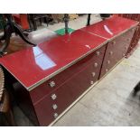 A pair of red lacquered and gilt metal mounted chest of drawers