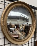 A gilt framed convex wall mirror