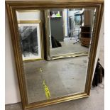 A large rectangular gilt framed wall mirror