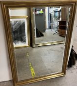 A large rectangular gilt framed wall mirror