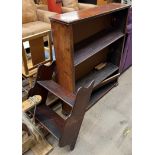 A mahogany waterfall hanging bookcase together with another bookcase