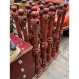 A set of sixteen cast iron fence posts with ball finials on square bases,