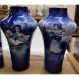 A pair of Royal Doulton blue and white vases transfer decorated with children seated under a tree,