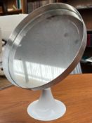 A Durlston Designs Ltd chrome vanity mirror of circular form on a white painted domed base