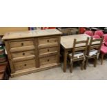 A modern pine chest of drawers together with a modern pine table and four chairs