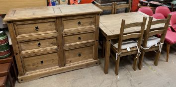 A modern pine chest of drawers together with a modern pine table and four chairs