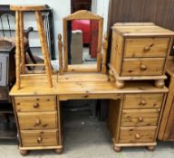 A pine dressing table together with a pine bedside chest,