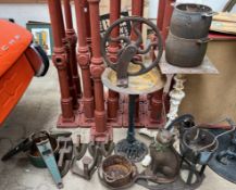 Flat irons together with a shoe last, tree stand, cast iron bird bath, cast iron table base,