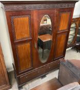 An Edwardian mahogany wardrobe together with a matching dressing table
