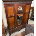 An Edwardian mahogany wardrobe together with a matching dressing table