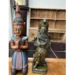 A carved oriental figure in prayer together with a samurai figure