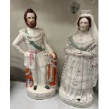A pair of Staffordshire figures of The Queen of England and The Prince of Wales