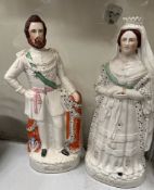 A pair of Staffordshire figures of The Queen of England and The Prince of Wales