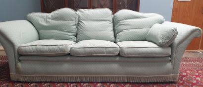 A pair of upholstered three seater settees,