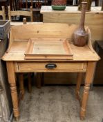 A pine wash stand with a three quarter gallery above a frieze drawer on turned legs together with a