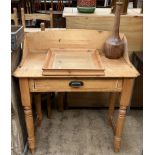 A pine wash stand with a three quarter gallery above a frieze drawer on turned legs together with a