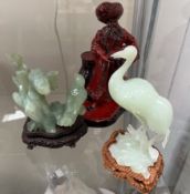 A Royal Doulton flambe figure lamp seller HN3278 together with two jade like hardstone figures of