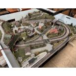 A model railway layout, with stations, buildings,