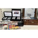 A mahogany lap top desk together with James Bond stamps,