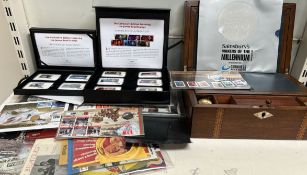 A mahogany lap top desk together with James Bond stamps,